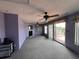 Bright living room with fireplace and access to deck at 848 S Waccamaw Dr., Garden City Beach, SC 29576