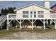 Elevated home with large deck and stairs at 848 S Waccamaw Dr., Garden City Beach, SC 29576