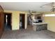 Open living room and kitchen area with stone breakfast bar at 848 S Waccamaw Dr., Garden City Beach, SC 29576