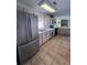 Spacious kitchen features stainless steel appliances and light wood cabinets at 848 S Waccamaw Dr., Garden City Beach, SC 29576
