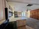 Kitchen features a breakfast bar and access to the living room at 848 S Waccamaw Dr., Garden City Beach, SC 29576