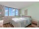 Bedroom with a dresser, ocean view, and light blue bedding at 9400 Shore Dr. # 917, Myrtle Beach, SC 29572