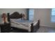 Bedroom with a dark wood bed frame and light gray walls at 2808 Stellar Loop, Myrtle Beach, SC 29577
