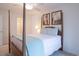 Bedroom with a post bed and access to the bathroom at 719 Blue Stem Dr. # 68D, Pawleys Island, SC 29585