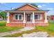 Brick home with front porch and landscaped yard at 1632 Butts St., Georgetown, SC 29440
