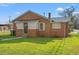 Red brick house with a green metal roof and small porch at 1632 Butts St., Georgetown, SC 29440