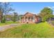 Brick house with a green metal roof and a small porch at 1632 Butts St., Georgetown, SC 29440
