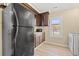 Galley kitchen with dark wood cabinets and appliances at 1632 Butts St., Georgetown, SC 29440