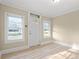 Bright living room with hardwood floors and large windows at 1632 Butts St., Georgetown, SC 29440