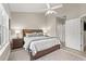 Spacious main bedroom with a large bed, dresser, and access to other rooms at 1025 Algonquin Dr. # 15-E, Pawleys Island, SC 29585