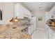 Modern kitchen with granite counters and white cabinets at 1025 Algonquin Dr. # 15-E, Pawleys Island, SC 29585
