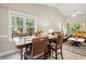 Dining area with a wooden table and leather chairs near the living room at 1025 Algonquin Dr. # 15-E, Pawleys Island, SC 29585