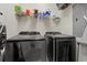 Laundry room with washer, dryer, and shelving at 1025 Algonquin Dr. # 15-E, Pawleys Island, SC 29585