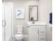 Clean bathroom featuring a shower, toilet, vanity with white cabinets, and a framed print at 2756 Rowyn St., Longs, SC 29568