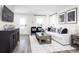 Living room with a white sofa, black chairs, and a wood coffee table at 2740 Rowyn St., Longs, SC 29568