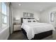 Bright bedroom featuring a comfortable bed and window with curtains at 2740 Rowyn St., Longs, SC 29568