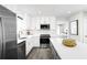 Modern kitchen with white cabinets, stainless steel appliances, and an island at 2740 Rowyn St., Longs, SC 29568