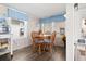 Bright dining area with wooden table and four chairs at 6001 South Kings Hwy., Myrtle Beach, SC 29575