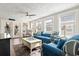 Cozy living room featuring comfy seating and access to a sunroom at 6001 South Kings Hwy., Myrtle Beach, SC 29575