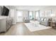 Bright living room with gray sofa and white coffee table at 2760 Rowyn St., Longs, SC 29568