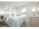 Light and airy bedroom with a comfortable bed and ocean-themed decor at 2748 Rowyn St., Longs, SC 29568