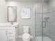 Modern bathroom with white vanity, frameless shower, and gray tile at 2748 Rowyn St., Longs, SC 29568