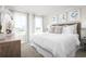 Bright main bedroom with a king-size bed and neutral decor at 2748 Rowyn St., Longs, SC 29568