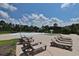 Community pool area with lounge chairs, a splash pad, and a playground at 1065 Wigeon Dr., Conway, SC 29526
