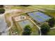 Aerial view of community amenities including tennis and pickle ball courts, playground, and basketball court at 1065 Wigeon Dr., Conway, SC 29526