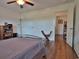 Bright bedroom with hardwood floors, a double bed, and access to a hallway at 1065 Wigeon Dr., Conway, SC 29526