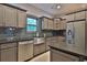 Modern kitchen with stainless steel appliances and dark gray cabinets at 1065 Wigeon Dr., Conway, SC 29526