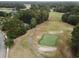 Aerial view of a golf course with a home nearby and surrounding neighborhood at 1065 Wigeon Dr., Conway, SC 29526