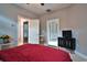 Bedroom with double bed, TV stand, and access to bathroom and hallway at 1065 Wigeon Dr., Conway, SC 29526