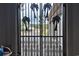 Ornate iron gate opens to a driveway and garage at 1065 Wigeon Dr., Conway, SC 29526