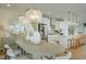 Bright dining area with a large oval table and statement lighting at 8479 Duke Pl. # 34, Myrtle Beach, SC 29572