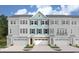 Modern three-story townhome with light teal exterior and two-car garage at 8481 Duke Pl. # 35, Myrtle Beach, SC 29572