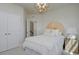 Bright bedroom with white bedding, a sunlit corner, and built-in closets at 8483 Duke Pl. # 36, Myrtle Beach, SC 29572