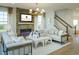 Living room featuring a fireplace, comfortable seating, and a modern aesthetic at 8483 Duke Pl. # 36, Myrtle Beach, SC 29572