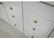 White bathroom vanity with gold drawer pulls at 8483 Duke Pl. # 36, Myrtle Beach, SC 29572
