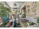 Relaxing screened porch with wicker furniture and plants at 2102 Calabash Circle, Little River, SC 29566