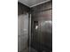 Bathroom with dark herringbone tile shower surround at 309 21St Ave. N, North Myrtle Beach, SC 29582