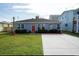 Newly built home with blue siding, red door, and concrete driveway at 309 21St Ave. N, North Myrtle Beach, SC 29582