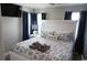 Spacious bedroom with king-size bed and blue curtains at 309 21St Ave. N, North Myrtle Beach, SC 29582