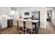 Modern kitchen with white cabinets, stainless steel appliances, and an island at 2744 Rowyn St., Longs, SC 29568