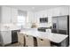 Modern kitchen with white cabinets and a large island at 2744 Rowyn St., Longs, SC 29568