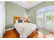 Bedroom with hardwood floors and French doors leading to balcony at 304 76Th Ave. N # D, Myrtle Beach, SC 29572