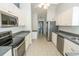 White kitchen with stainless steel appliances and dark countertops at 105 Bonnie Bridge Circle, Myrtle Beach, SC 29579