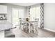 Kitchen dining area with four chairs and sliding glass door at 3006 Nw Edgemead Circle # B, Calabash, NC 28467