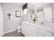 Modern bathroom with double vanity, gray flooring, and white cabinets at 3006 Nw Edgemead Circle # B, Calabash, NC 28467