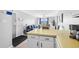 View of kitchen with yellow countertops and access to the living area at 4801 North Ocean Blvd. # 3N, North Myrtle Beach, SC 29582